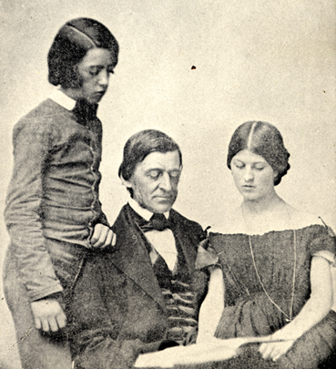 Photograph of Ralph Waldo Emerson reading with adolescents Edward and Edith, from Emerson family photograph album.