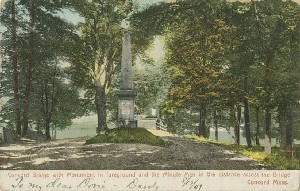 Concord Bridge with 
	Monument in foreground and the Minute Man in the distance across the bridge, Concord, Mass.; circa 1906 (earliest postmark)