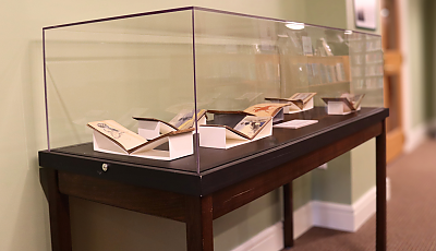 books exhibited in the hallway exhibition cases banner