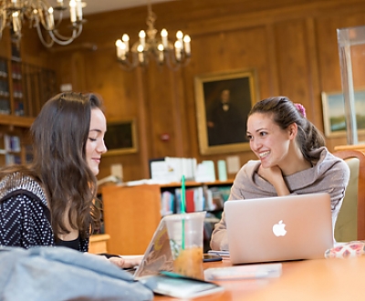 Students talking in library background image