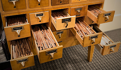 a card catalog filled with knitting needles banner