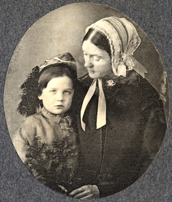 Photograph of Lidian Emerson holding young son Edward, from Emerson family photograph album.