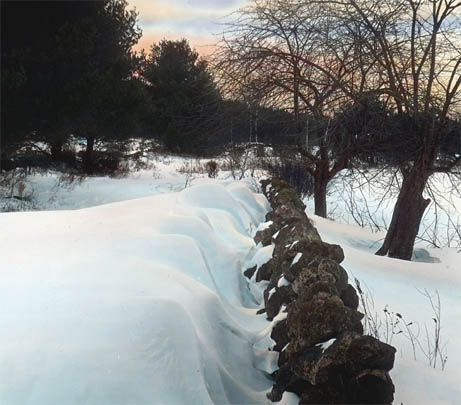 Snow-drifts behind stone wall