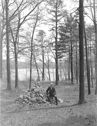 H.W. Gleason at Thoreau's carin, Walden Pond
